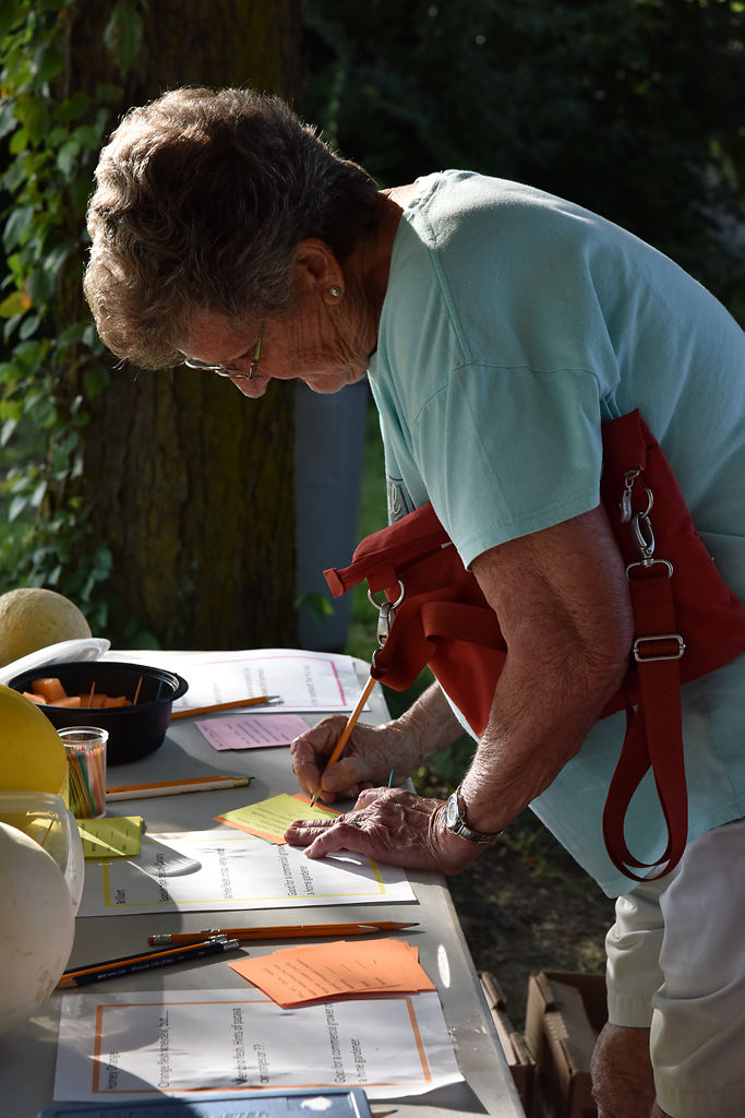 Olinda Cash fills out a comment card following a taste test of the Brilliant/Canary melon